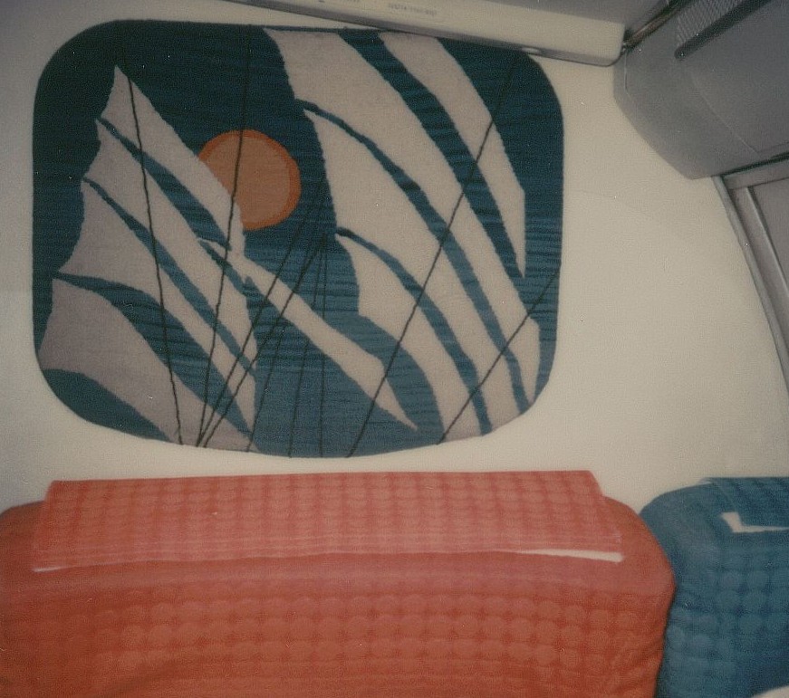 January 1979 economy class bulkhead artwork.  This fabric representation of a clipper ship's sails appeared on the right side bulkhead  behind first class at the front of the economy cabin.